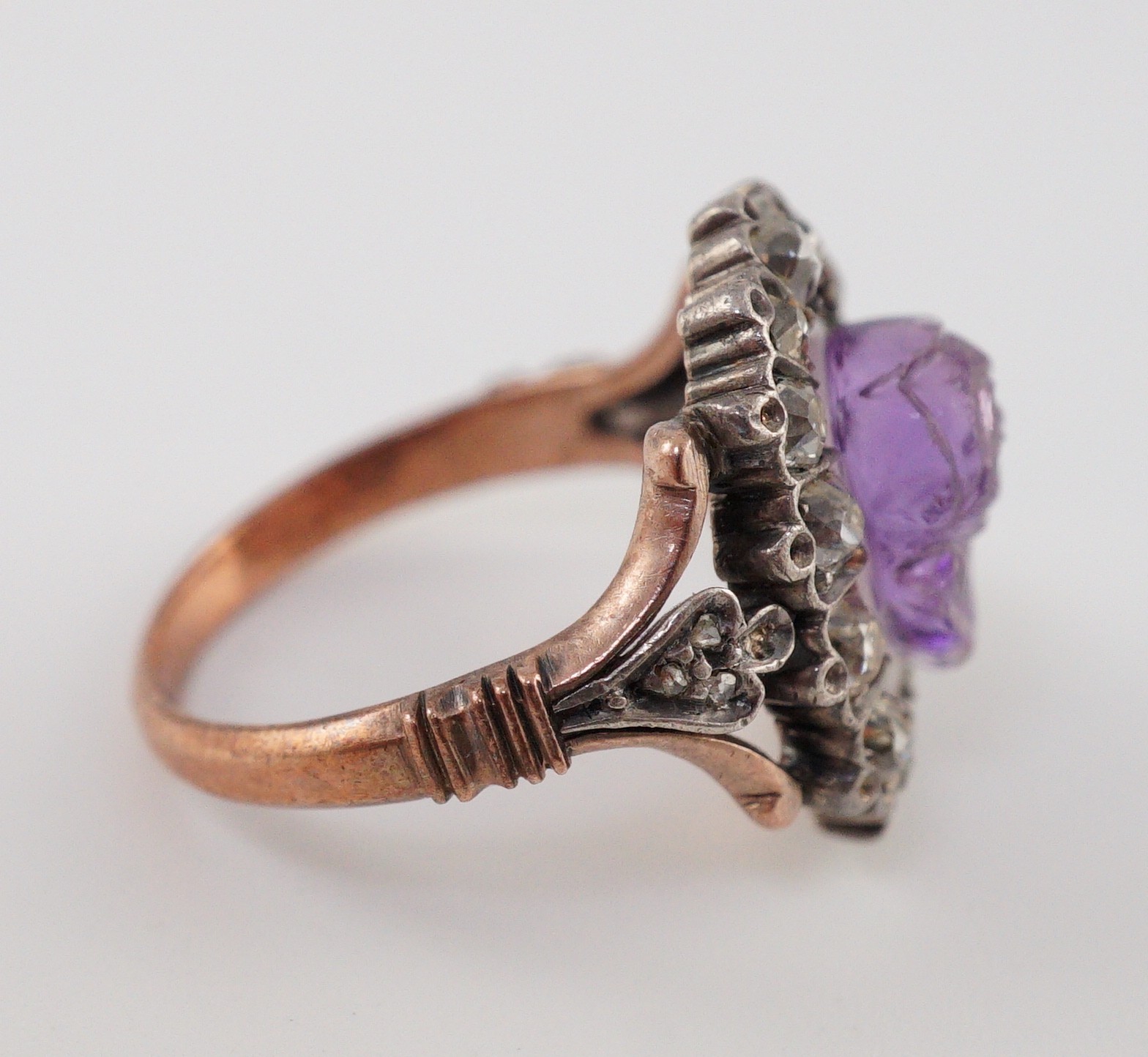 A 19th century gold, carved amethyst and diamond cluster set dress ring